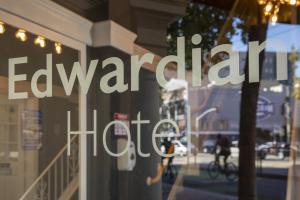 a window of a store with the words elevated habitat at Edwardian Hotel in San Francisco